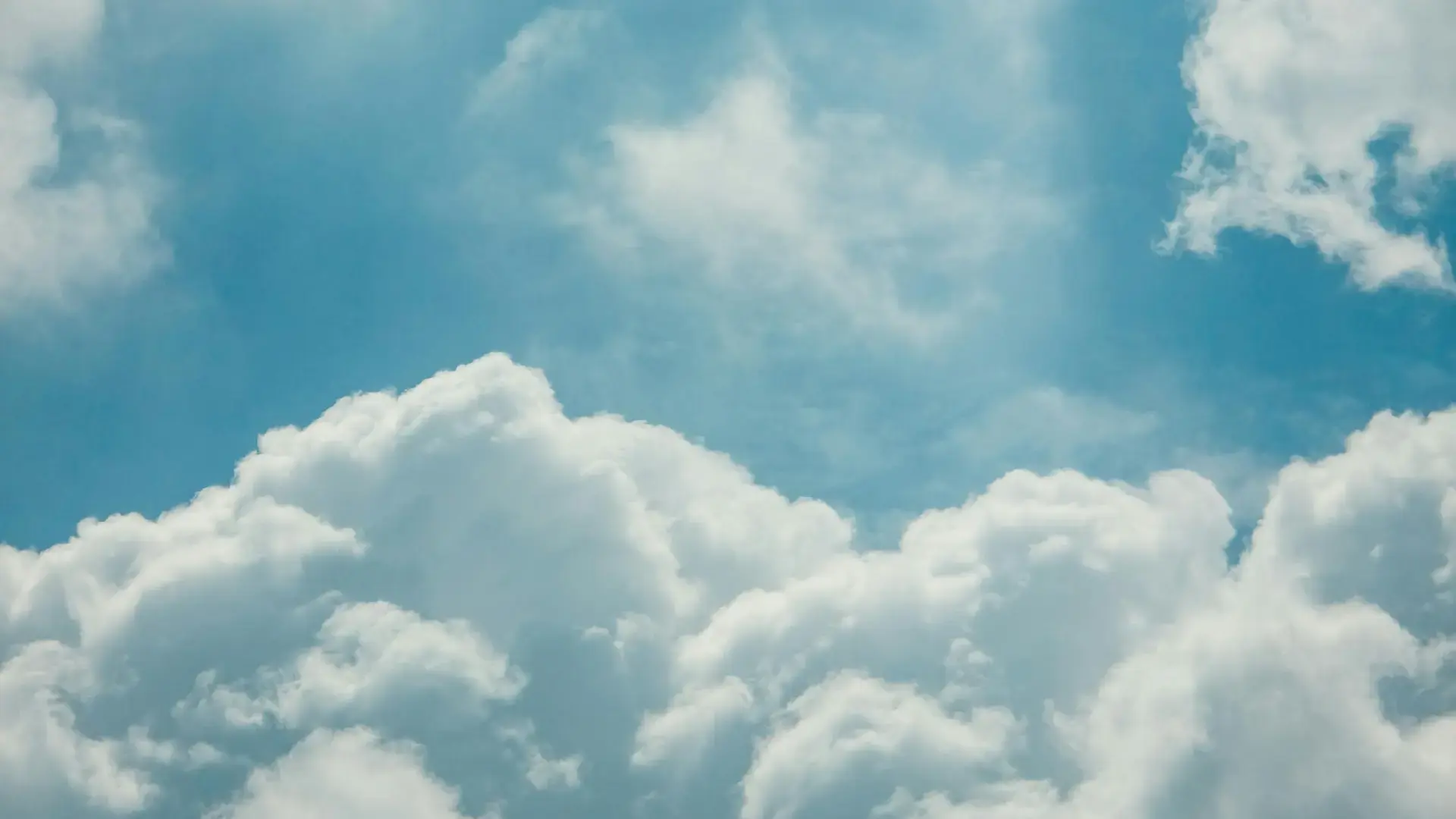 blue-sky-with-fluffy-white-clouds-33683959